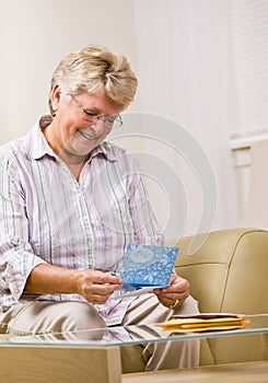Senior woman reading note card