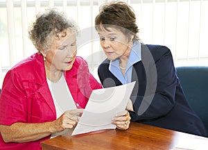 Senior Woman Reading Paperwork