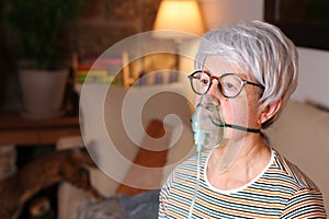 Senior woman receiving oxygen therapy