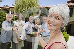 Senior Woman Recording Happy Moments photo