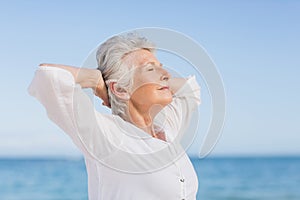 Senior woman relaxing on the beach