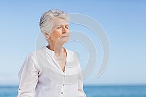 Senior woman relaxing on the beach