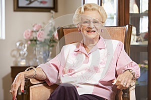 Senior woman relaxing in chair