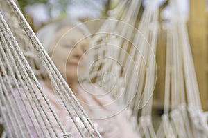 The senior woman relaxing in a hammock