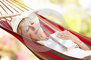 Senior Woman Relaxing In Hammock