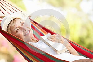 Senior Woman Relaxing In Hammock