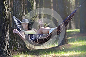 Senior Woman Relaxing In Hammock.