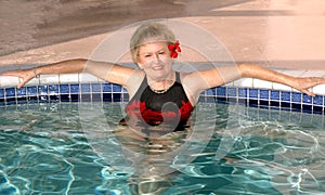 Senior woman relaxing in the pool