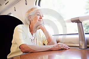 Senior Woman Relaxing On Train Journey