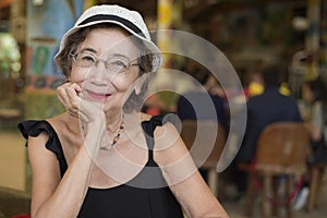 Senior Woman In The Restaurant