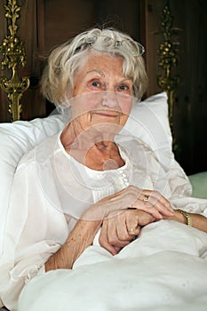 Senior woman resting in bed