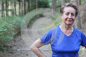 Senior Woman Resting After Exercising In Park