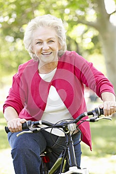 Senior woman riding bike