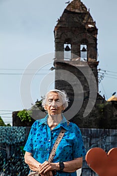 Senior woman at the ruins of the Convent of Santo Domingo in the city of Mariquita photo