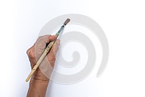 Senior woman`s left hand painting with paintbrush isolated on white background