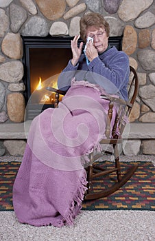 Senior Woman Sad Cry Rocking Chair Fireplace