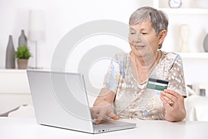 Senior woman shopping on internet