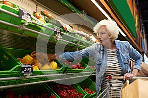 Senior Woman Shopping in Supermarket