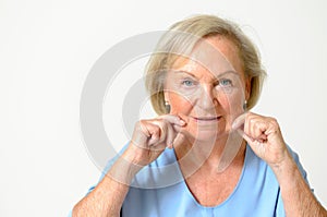 Senior woman showing her face, effect of aging