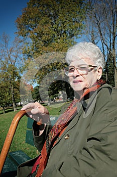 Senior woman sit on a bench