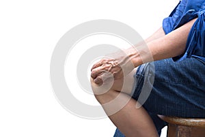 Senior woman sit on the chair with knee and joint pain isolated