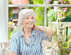 Senior woman sitting at home 5