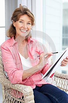 Senior woman sketching photo