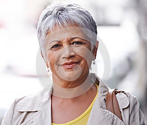 Senior woman, smile and portrait in outdoor or urban for style and travel in city for retired and elderly in Amsterdam