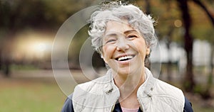 Senior woman with a smile, portrait in the park and happiness in nature, woods or outdoor for a walk in retirement