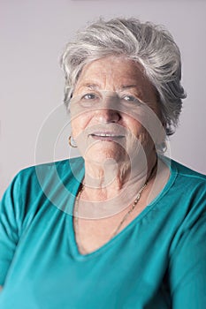 Senior woman smiling in studio portrait