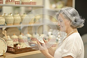Senior woman at souvenir store