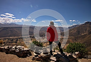 Senior woman standing above the valley