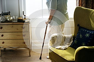 Senior woman standing alone in the room