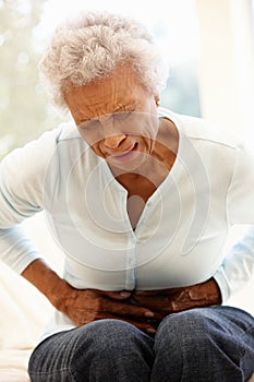 Senior woman with stomach ache