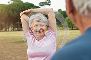 Senior woman stretching arms