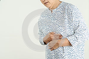 Senior woman Suffering From Acid Reflux Or Heartburn-Isolated On White Background