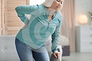 Senior woman suffering from back pain