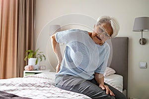 Senior woman suffering from back pain