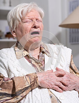 Senior woman suffering from heart attack