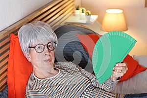 Senior woman suffering during heatwave
