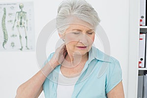 Senior woman suffering from neck pain