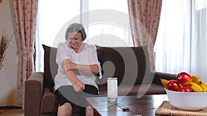 Senior woman suffering from pain in hand