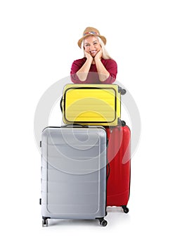 Senior woman with suitcases