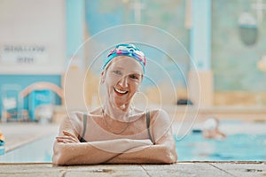 Senior woman, swimmer in water and relax in swimming pool of hotel resort for healthy elderly exercise, swim training