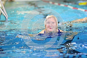 Senior woman swimming in the pool