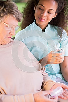 Senior woman taking medicament