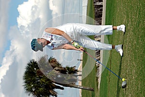 Senior woman tee off