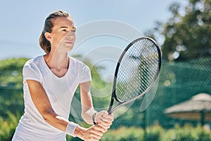 Senior woman, tennis player and ready in sports game for ball, match or hobby on the court. Happy elderly female in