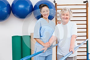 Senior woman and therapist looking at camera