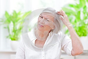 Senior woman thinning hair loss